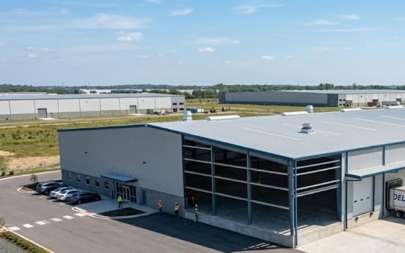 key components of a pre-engineered building including primary steel frame, secondary framing, roof panels, and wall cladding